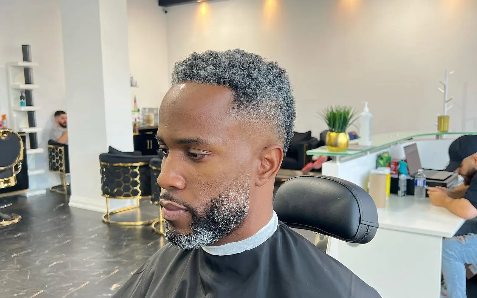 Close look at a blended fade on grey-flecked hair