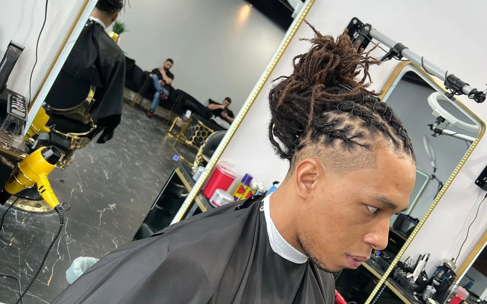 Client with a fresh haircut at S Blends Barbershop
