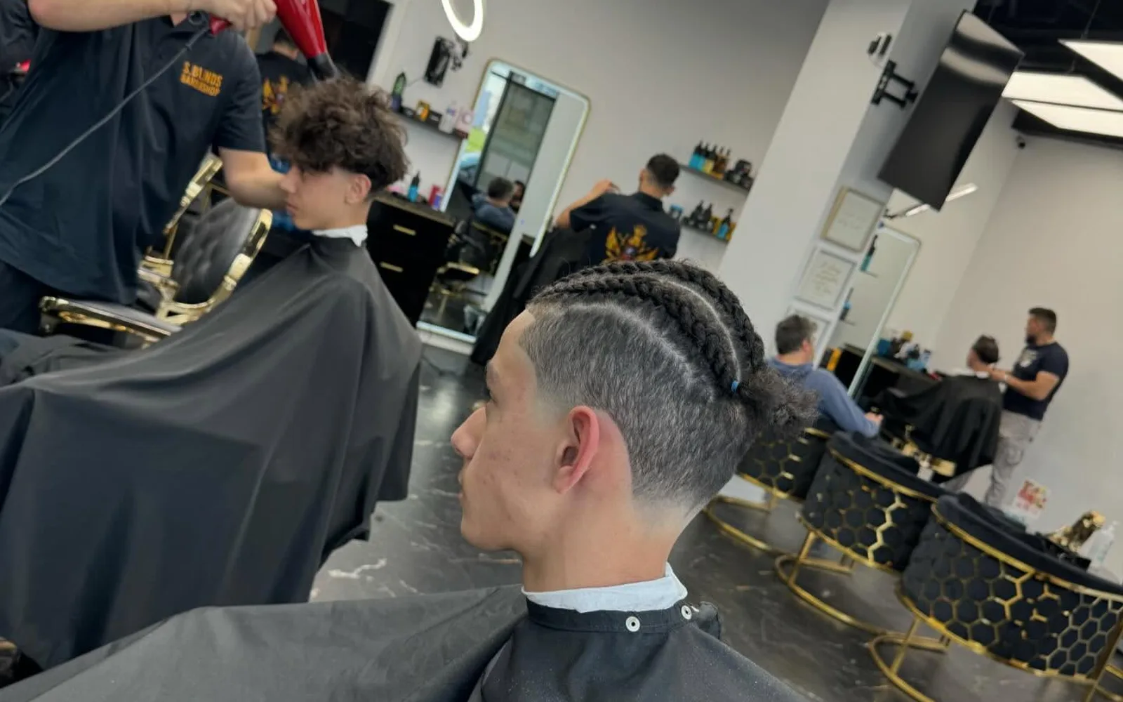 Interior of S Blends Barbershop with chairs, mirrors and wash station