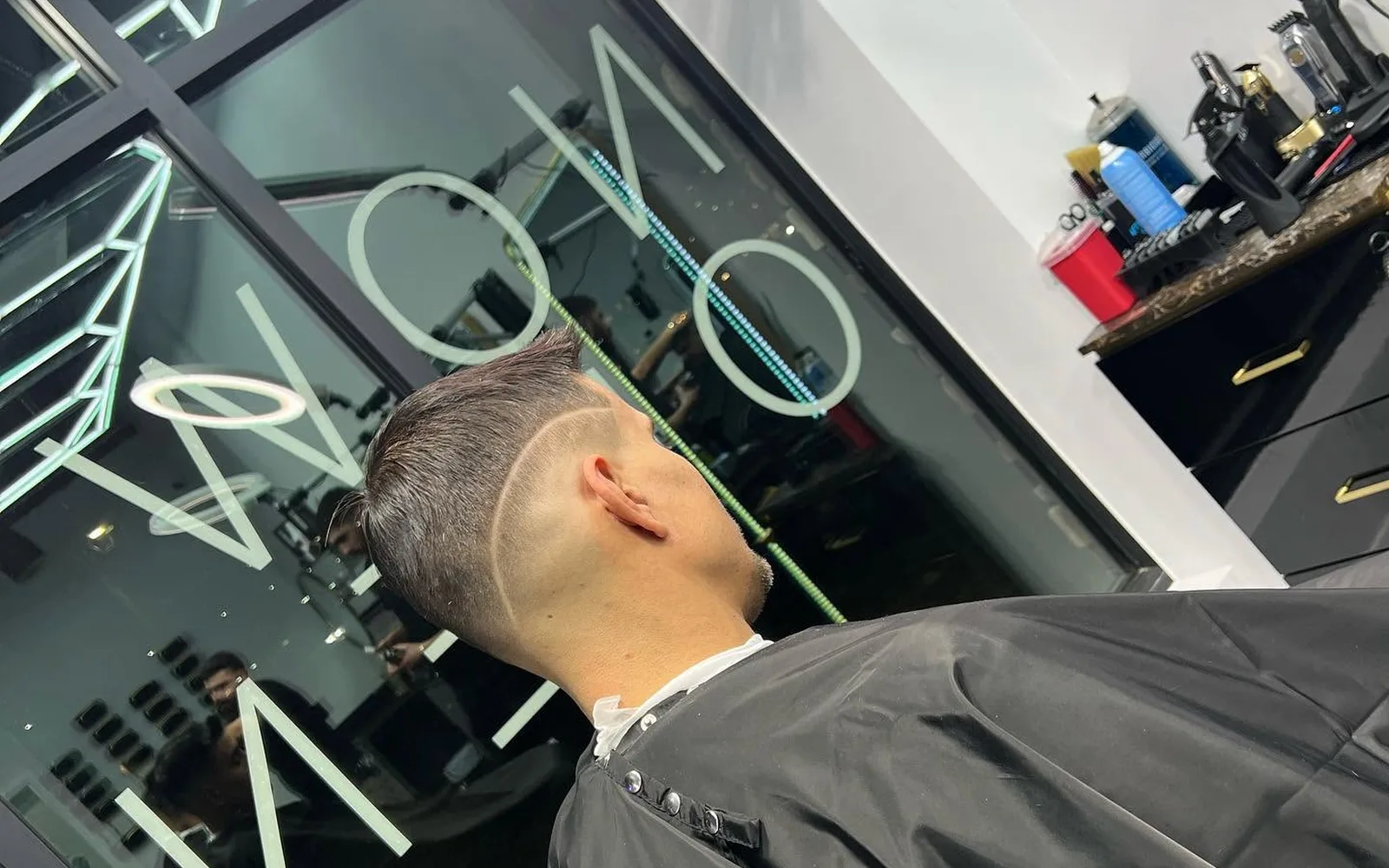 Barber station with ring light and tools at S Blends